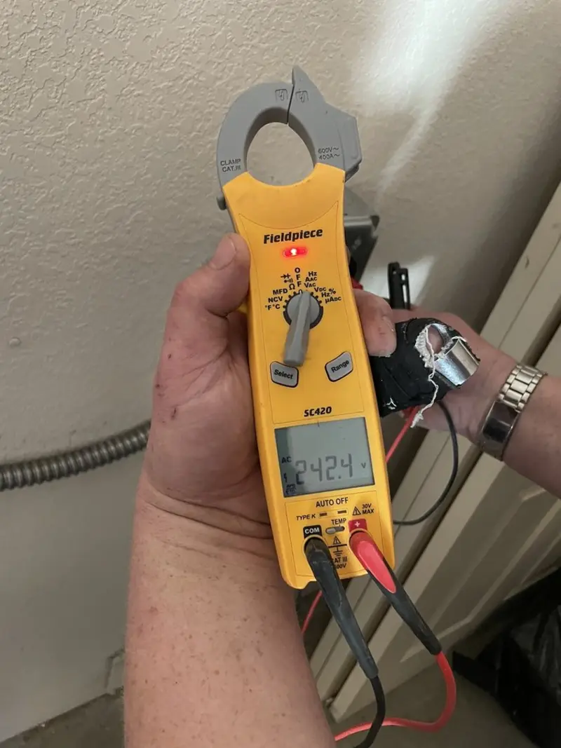 Voltage testing with clamp meter during Circuit Breaker Repair in Springfield